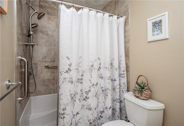 full bath with a shower with curtain and toilet