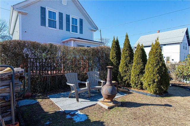 view of yard with fence and a patio