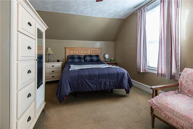 carpeted bedroom with vaulted ceiling