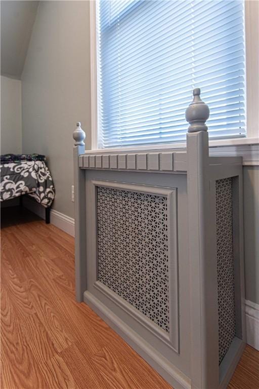 room details featuring baseboards and wood finished floors