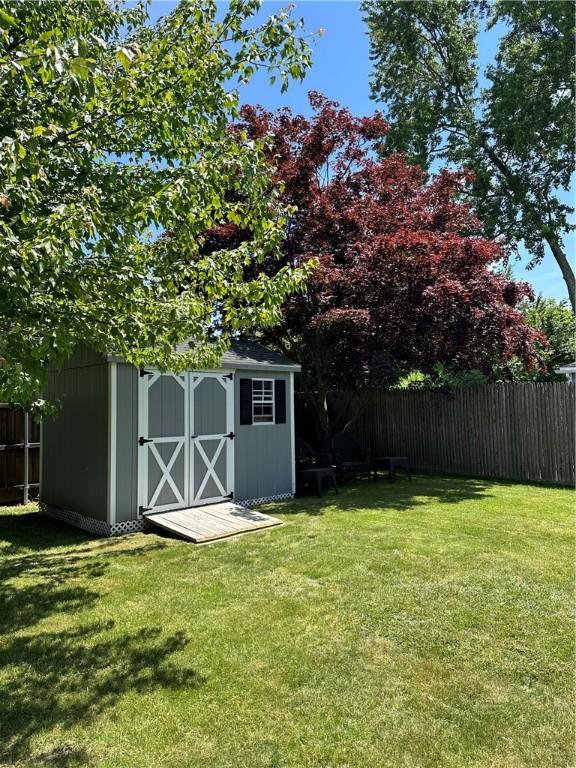 view of shed featuring fence