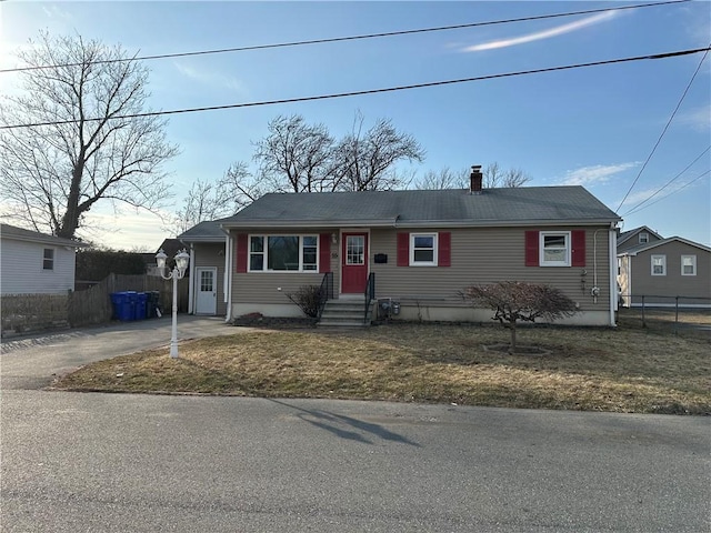 view of front of house featuring fence and a chimney