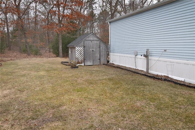 view of yard featuring a storage unit and an outbuilding