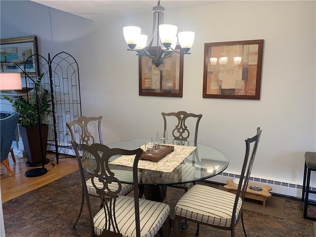 dining room with a baseboard heating unit, a notable chandelier, and wood finished floors