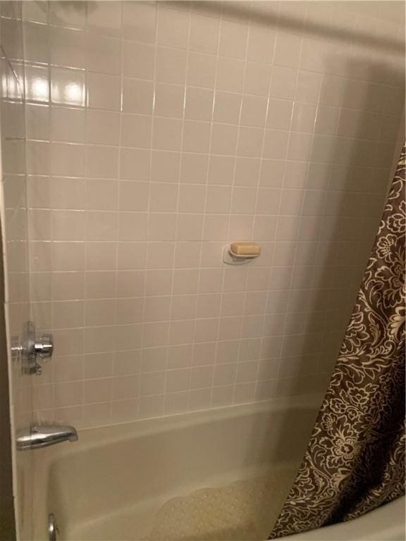 full bathroom with shower / bath combo