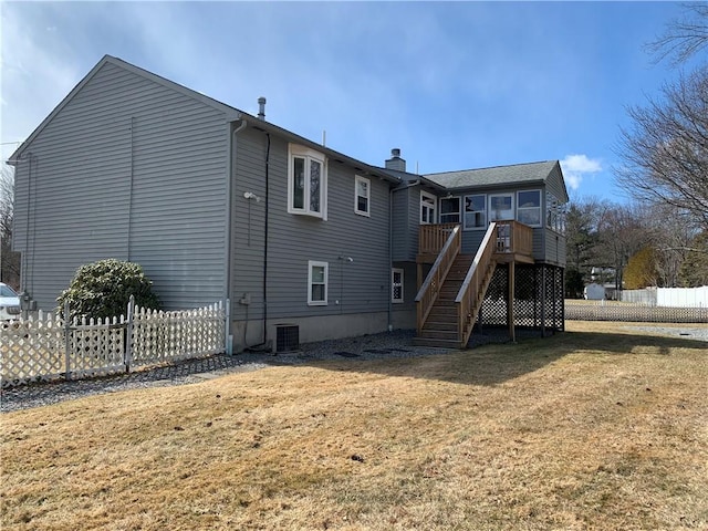 rear view of house featuring a lawn, stairway, central AC, fence, and a deck