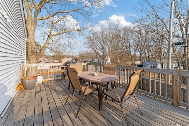 deck with outdoor dining area