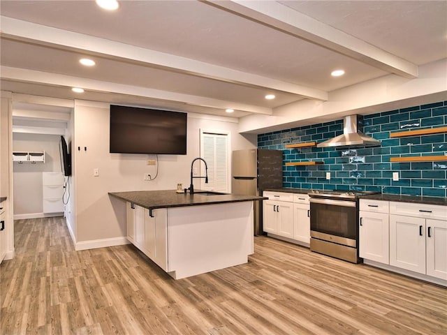 kitchen featuring light wood finished floors, open shelves, stainless steel appliances, beamed ceiling, and wall chimney exhaust hood