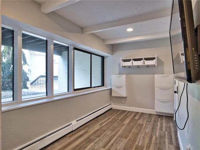 bathroom with recessed lighting, a baseboard heating unit, wood finished floors, baseboards, and beamed ceiling