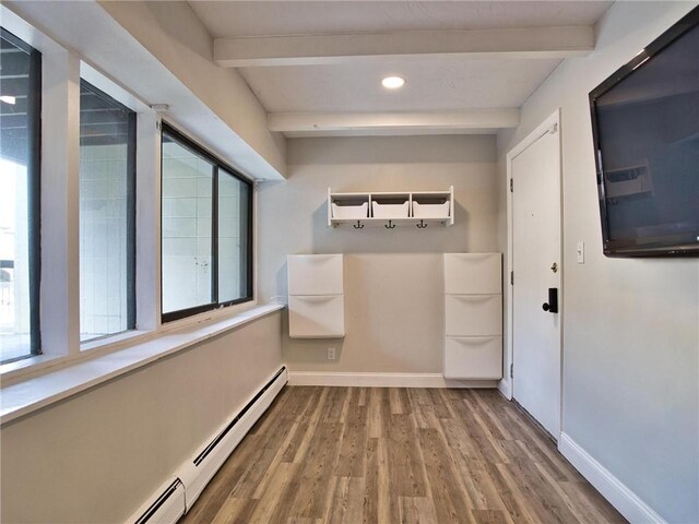 mudroom with wood finished floors, beam ceiling, and baseboards