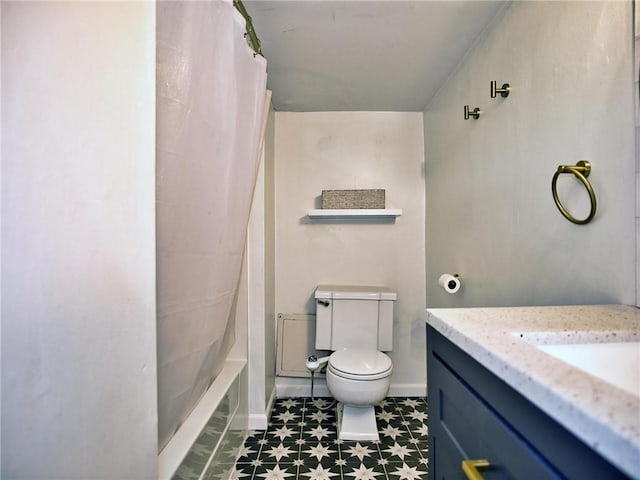 bathroom featuring toilet, tile patterned floors, and vanity