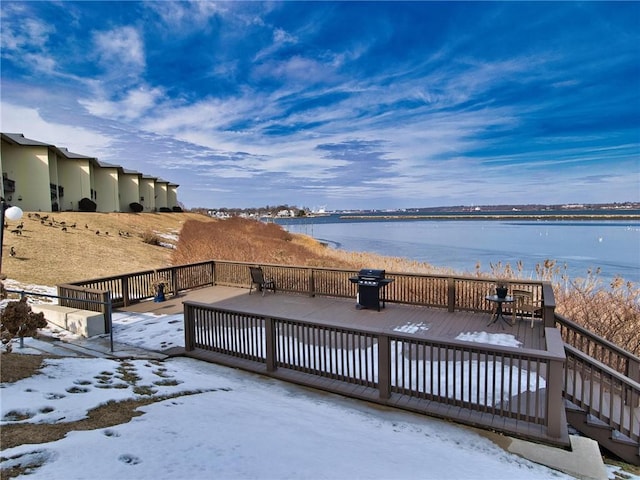 exterior space with a deck with water view