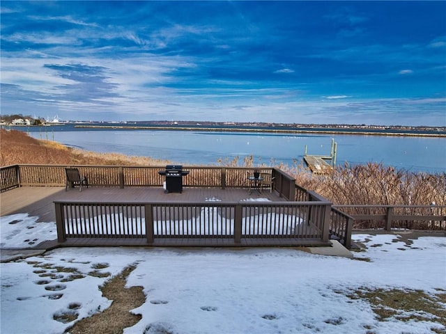 exterior space with a water view and area for grilling