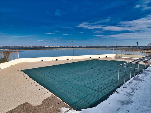 view of pool featuring a water view