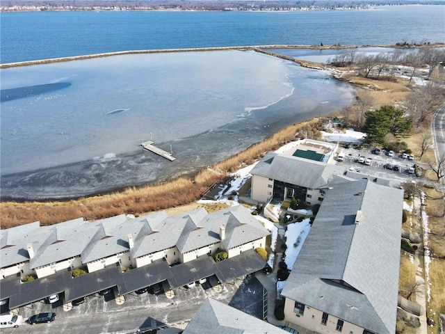 drone / aerial view featuring a residential view and a water view