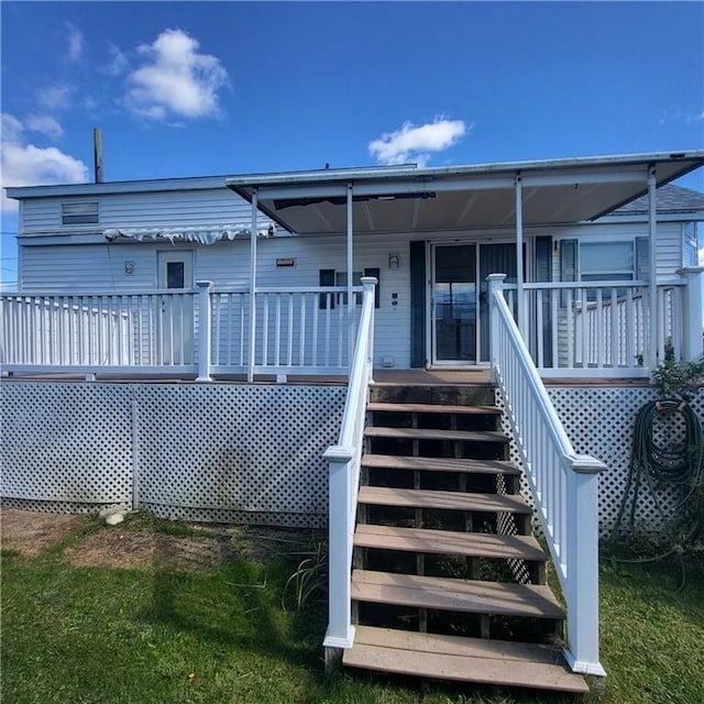 rear view of property featuring stairway