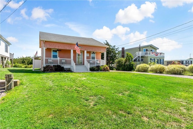 view of front of house featuring covered porch and a front lawn