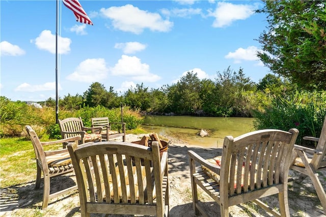 view of patio with a water view