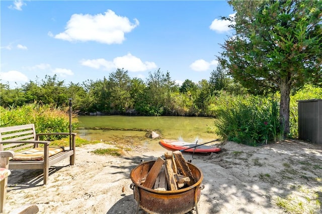 view of patio with a fire pit