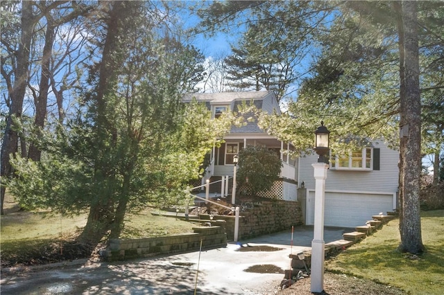 view of front of home with a garage and concrete driveway