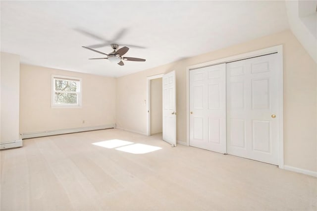 unfurnished bedroom featuring baseboards, ceiling fan, and baseboard heating