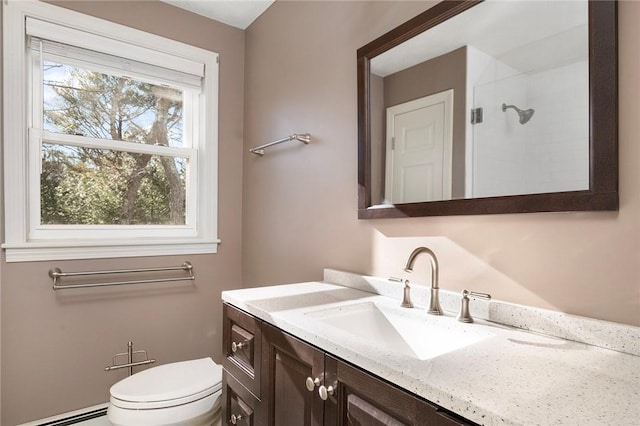 bathroom featuring toilet, a baseboard radiator, walk in shower, and vanity