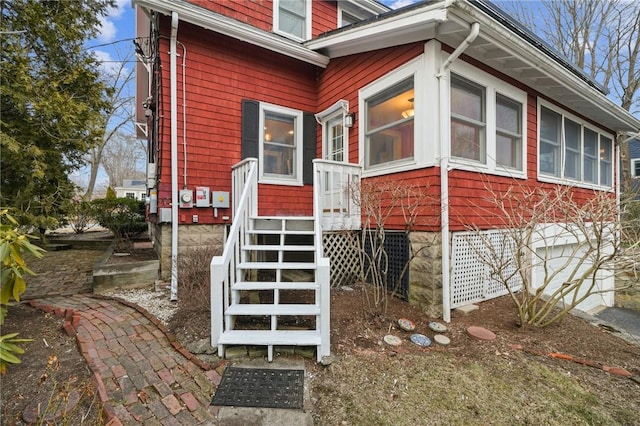 view of home's exterior with a sunroom