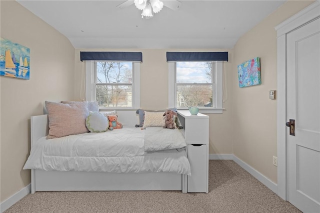 carpeted bedroom with baseboards