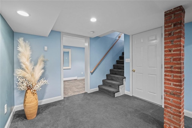 finished basement with dark colored carpet, recessed lighting, baseboards, and stairs