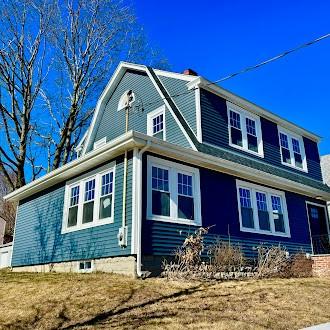 view of home's exterior featuring a gambrel roof