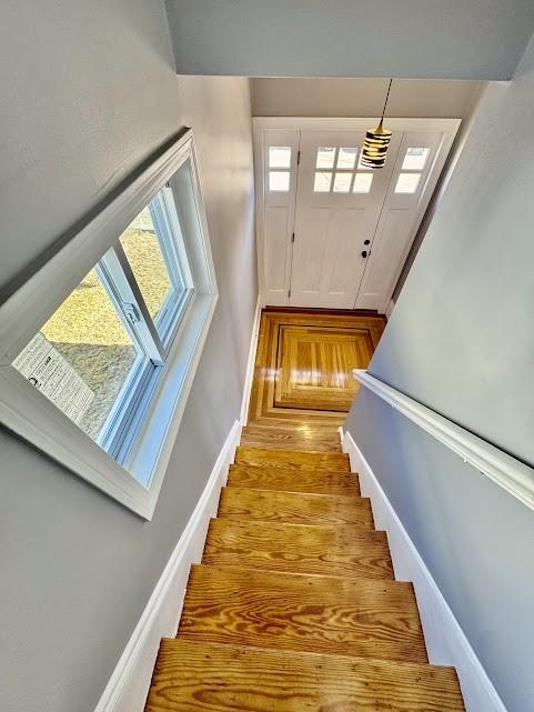 stairway featuring baseboards