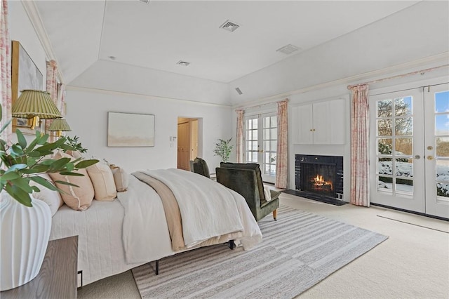 bedroom with access to exterior, french doors, visible vents, and light carpet