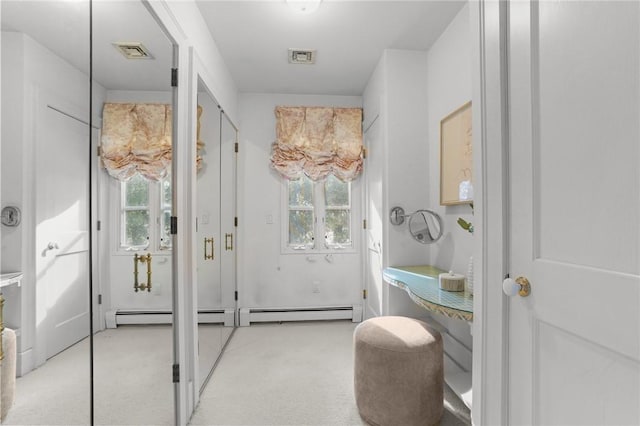 bathroom with a healthy amount of sunlight and visible vents