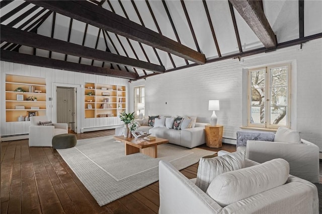 living area with a healthy amount of sunlight, a baseboard heating unit, and hardwood / wood-style floors