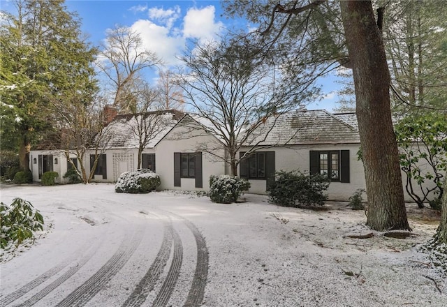 single story home featuring stucco siding