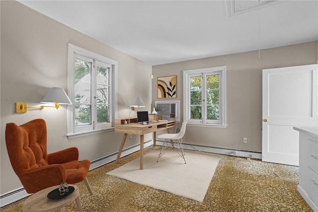 home office with baseboard heating, attic access, and a healthy amount of sunlight