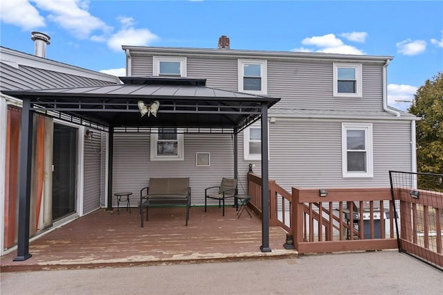 exterior space featuring a carport and a gazebo