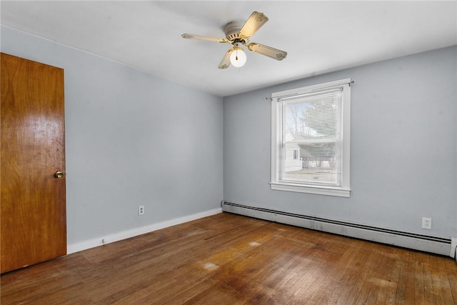 empty room with wood-type flooring, baseboards, baseboard heating, and a ceiling fan