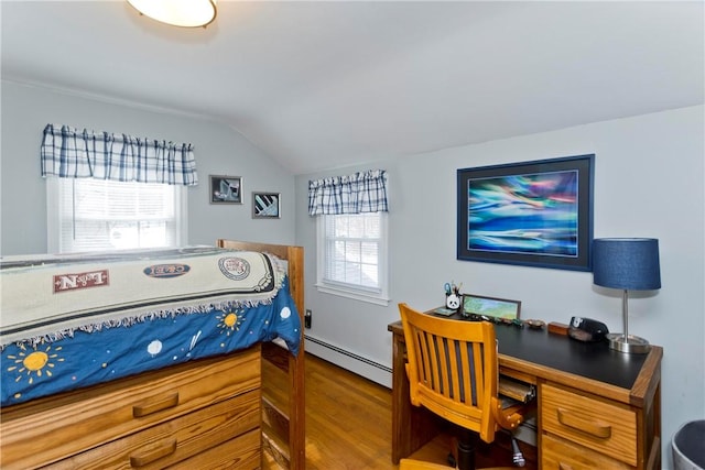 bedroom featuring vaulted ceiling, baseboard heating, and wood finished floors