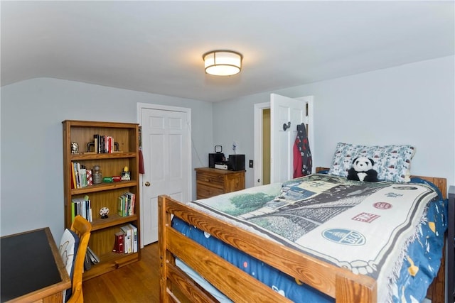 bedroom featuring wood finished floors