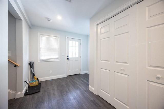 interior space featuring dark wood finished floors and baseboards