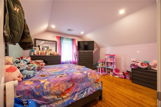 bedroom featuring lofted ceiling, wood finished floors, visible vents, and recessed lighting