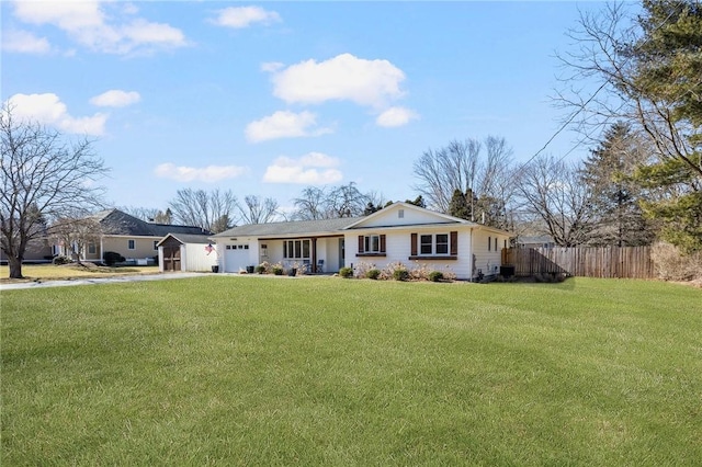 ranch-style house with a front lawn, fence, driveway, and an attached garage