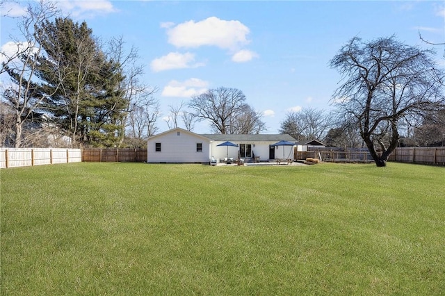 view of yard featuring a fenced backyard and a patio