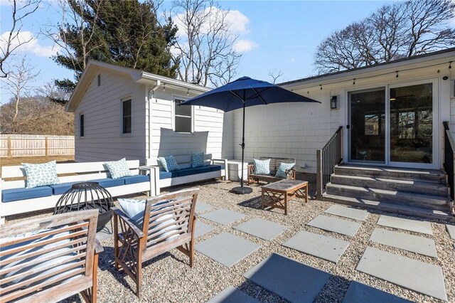 view of patio / terrace with entry steps, fence, and an outdoor hangout area