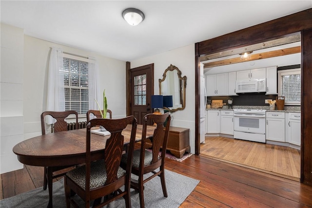 dining area featuring hardwood / wood-style flooring