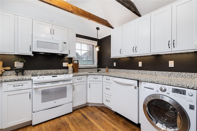 kitchen with white appliances, washer / dryer, and white cabinets