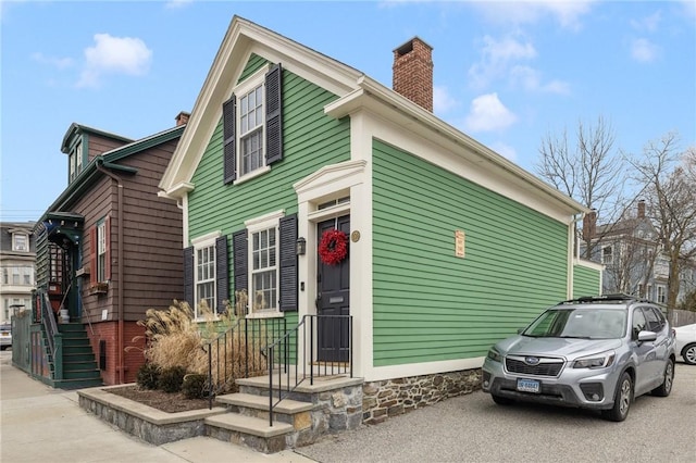 view of front of property featuring a chimney