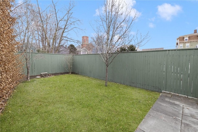 view of yard featuring a fenced backyard