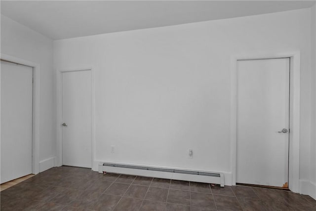 spare room with a baseboard heating unit